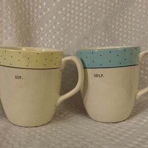 Two Rae Dunn coffee mugs, “Sip” and “Gulp”. 4.5 inches high.
